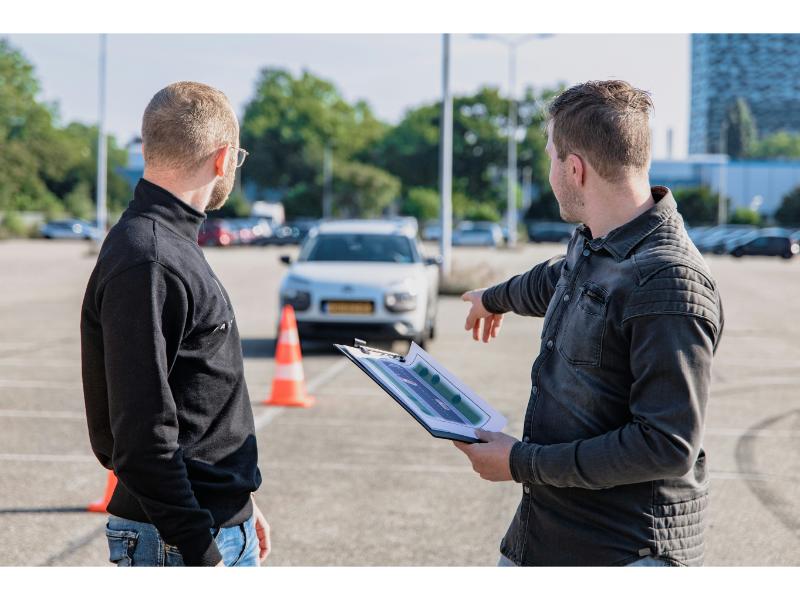 2 men working on the road on safety