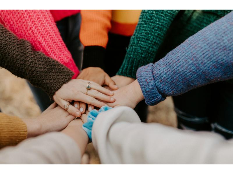 People joining hands together