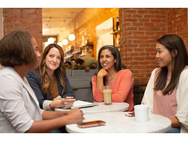 Group of people meeting together around the table