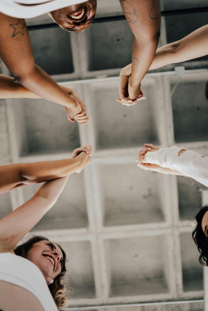 People joining hands together